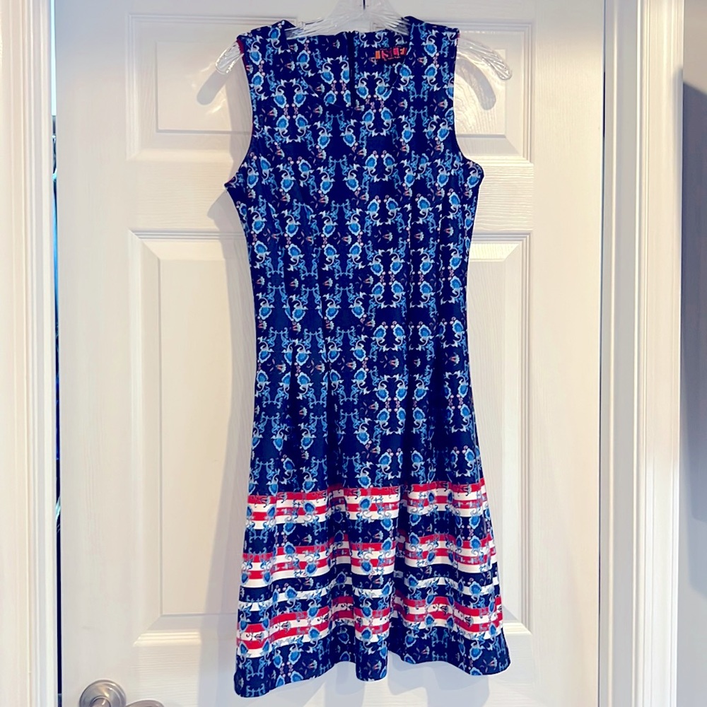Isle A-line tank dress.Drop waist.Polyester & spandex.Zippered back.Scoop neck
